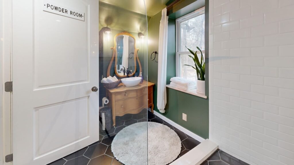 Powder room with vintage mirror