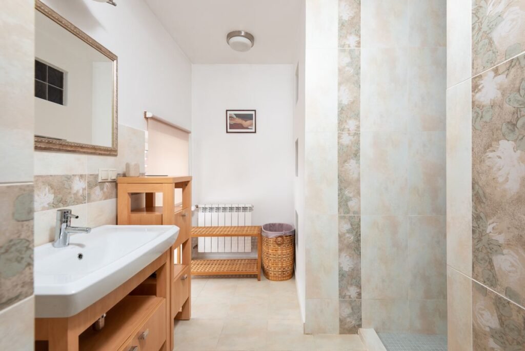 Bathroom with wooden shelves and floral tile