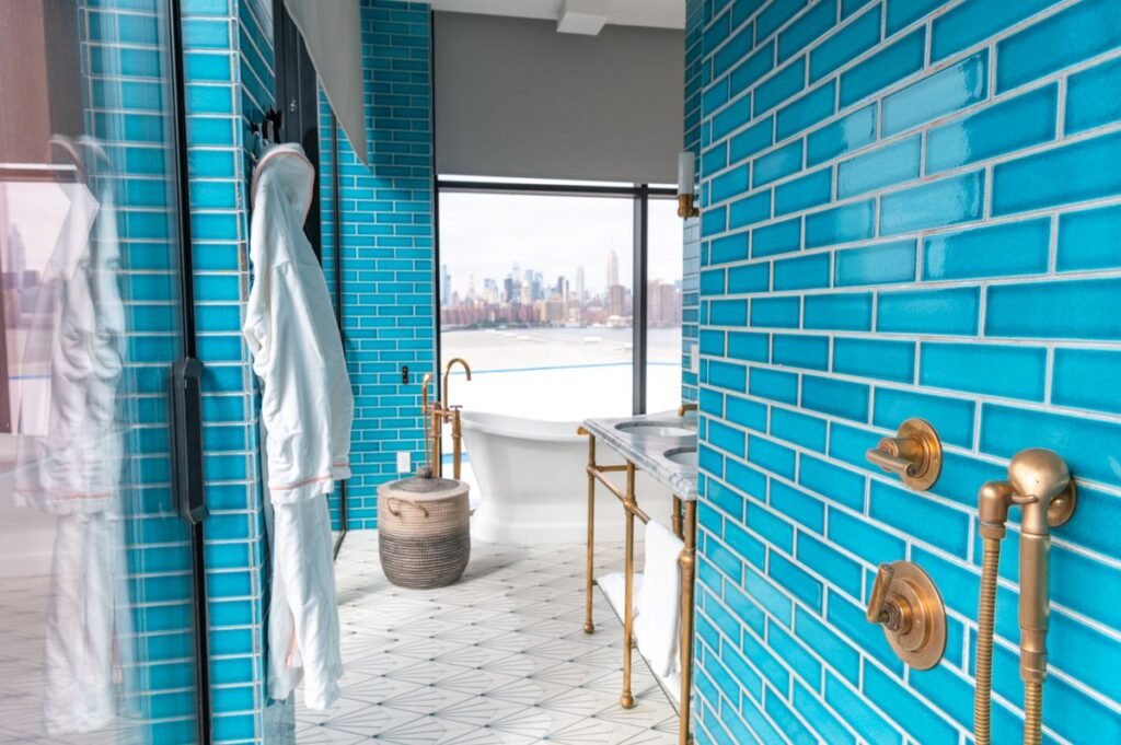 Bathroom with blue patterned tiles and mirror