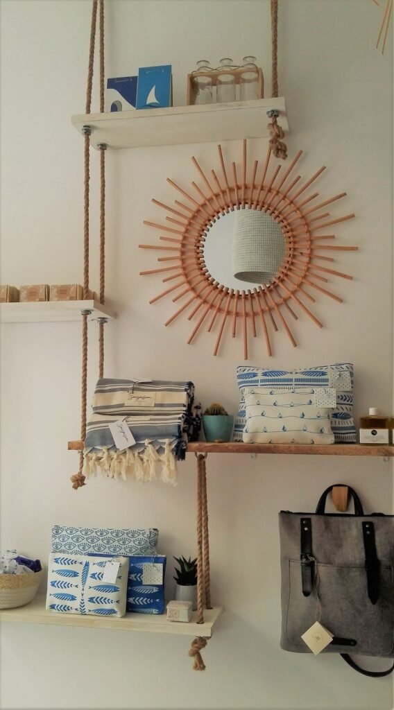 picture ledge with framed art in a living room