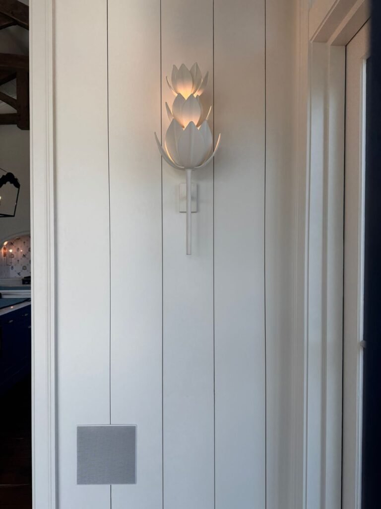 wall sconces with wall art in a living room
